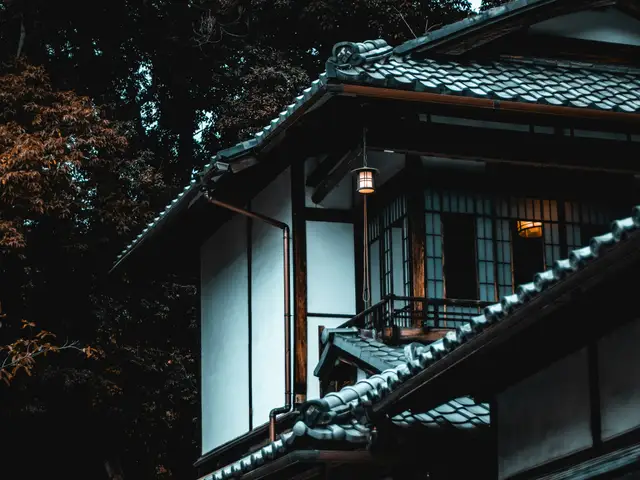white and brown house beside tree