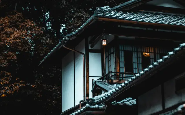 white and brown house beside tree