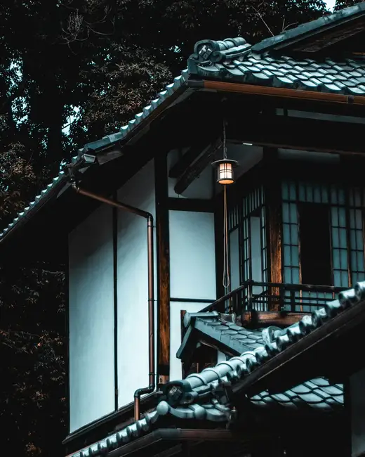 white and brown house beside tree