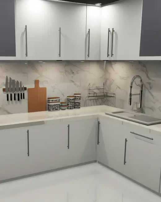 A kitchen with white cabinets and marble counter tops